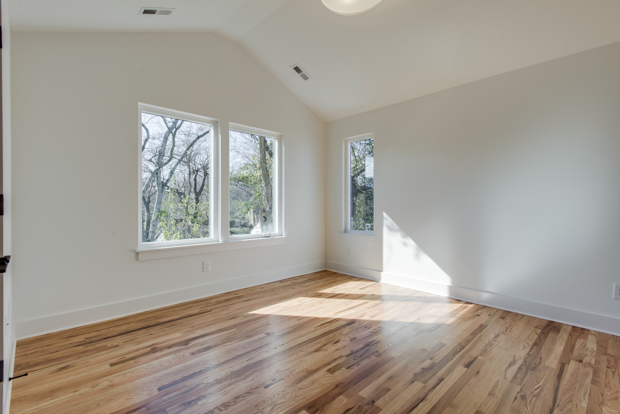 505 Croley Drive Nashville, TN 37209 - Photo 32 of 38 an empty room with wooden floor and windows