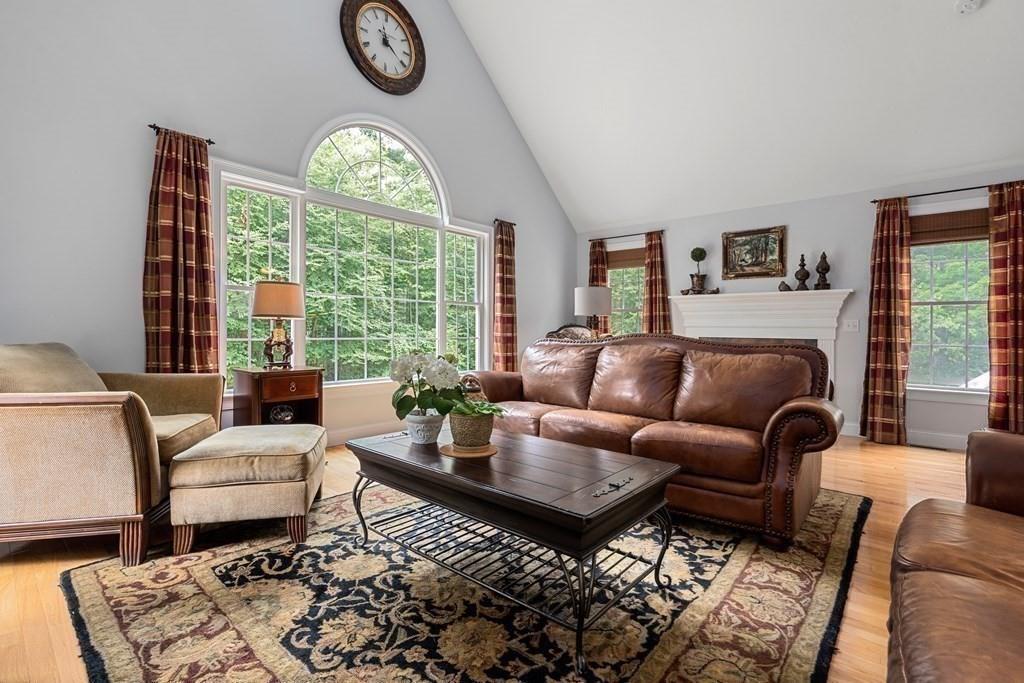 253 Walker Road Sturbridge, MA 01566 - Photo 14 of 31 a living room with furniture a table and a large window
