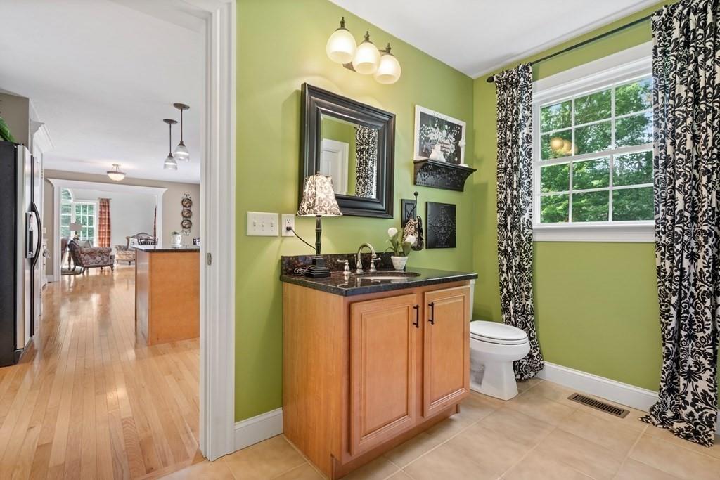 253 Walker Road Sturbridge, MA 01566 - Photo 20 of 31 a bathroom with a granite countertop sink and a mirror