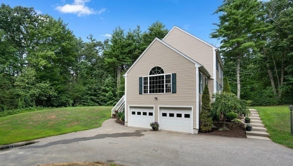 253 Walker Road Sturbridge, MA 01566 - Photo 29 of 31 a view of house with a yard and potted plants