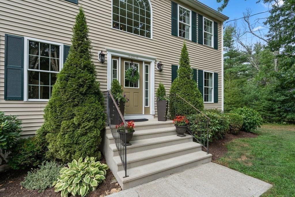 253 Walker Road Sturbridge, MA 01566 - Photo 4 of 31 a view of a house with potted plants and a garden
