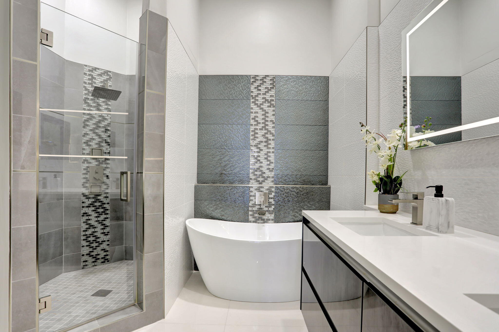 a bathroom with a bathtub and a sink