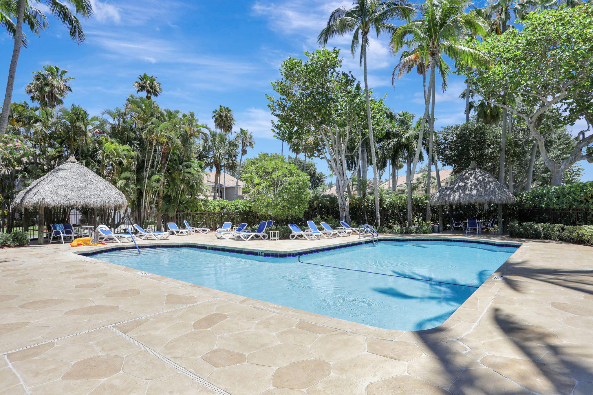 6584 Villa Sonrisa Drive, Unit 1122 Boca Raton, FL 33433 - Photo 22 of 22 a view of a swimming pool and lounge chair