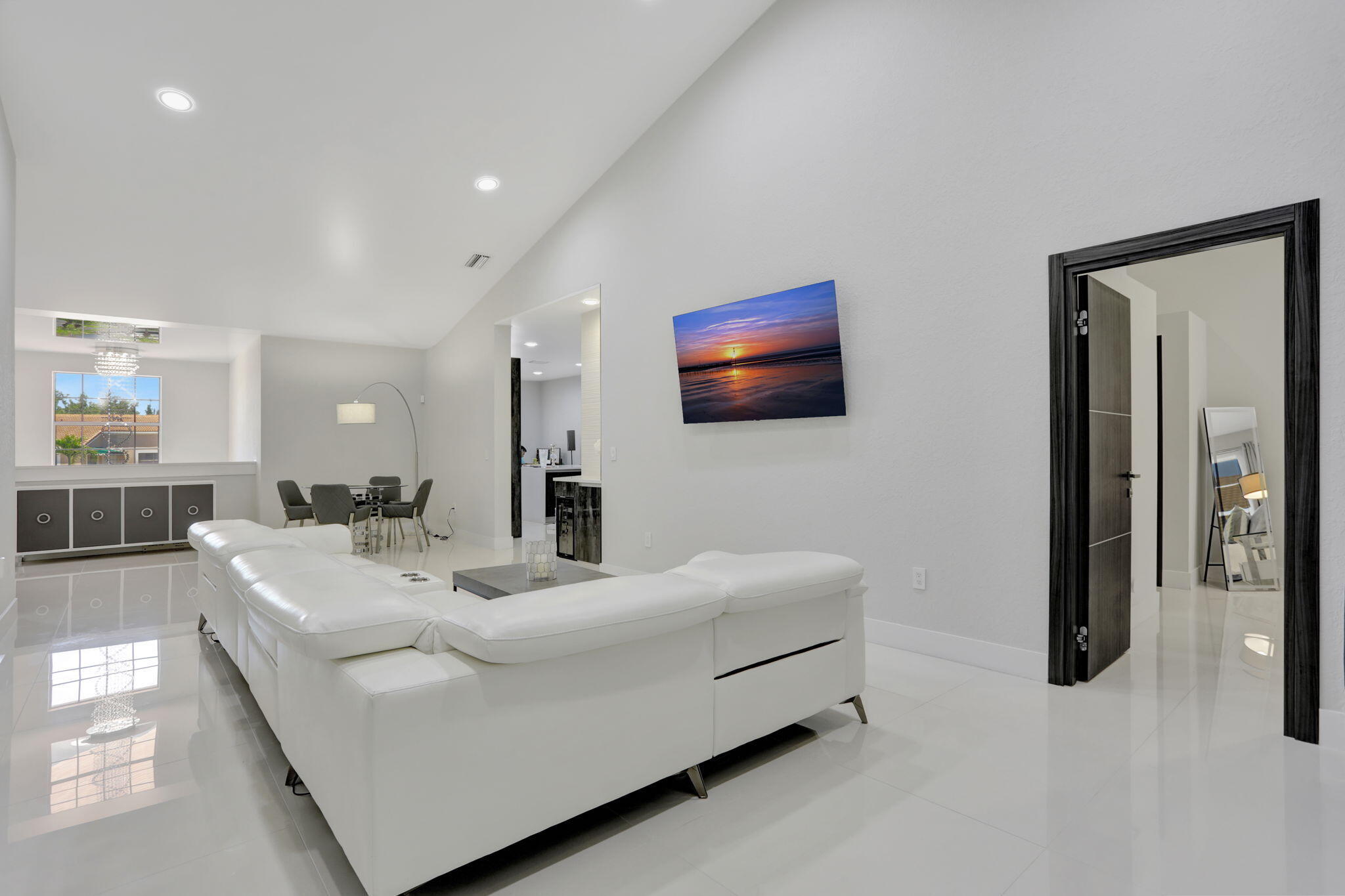 6584 Villa Sonrisa Drive, Unit 1122 Boca Raton, FL 33433 - Photo 8 of 22 a living room with furniture and a flat screen tv