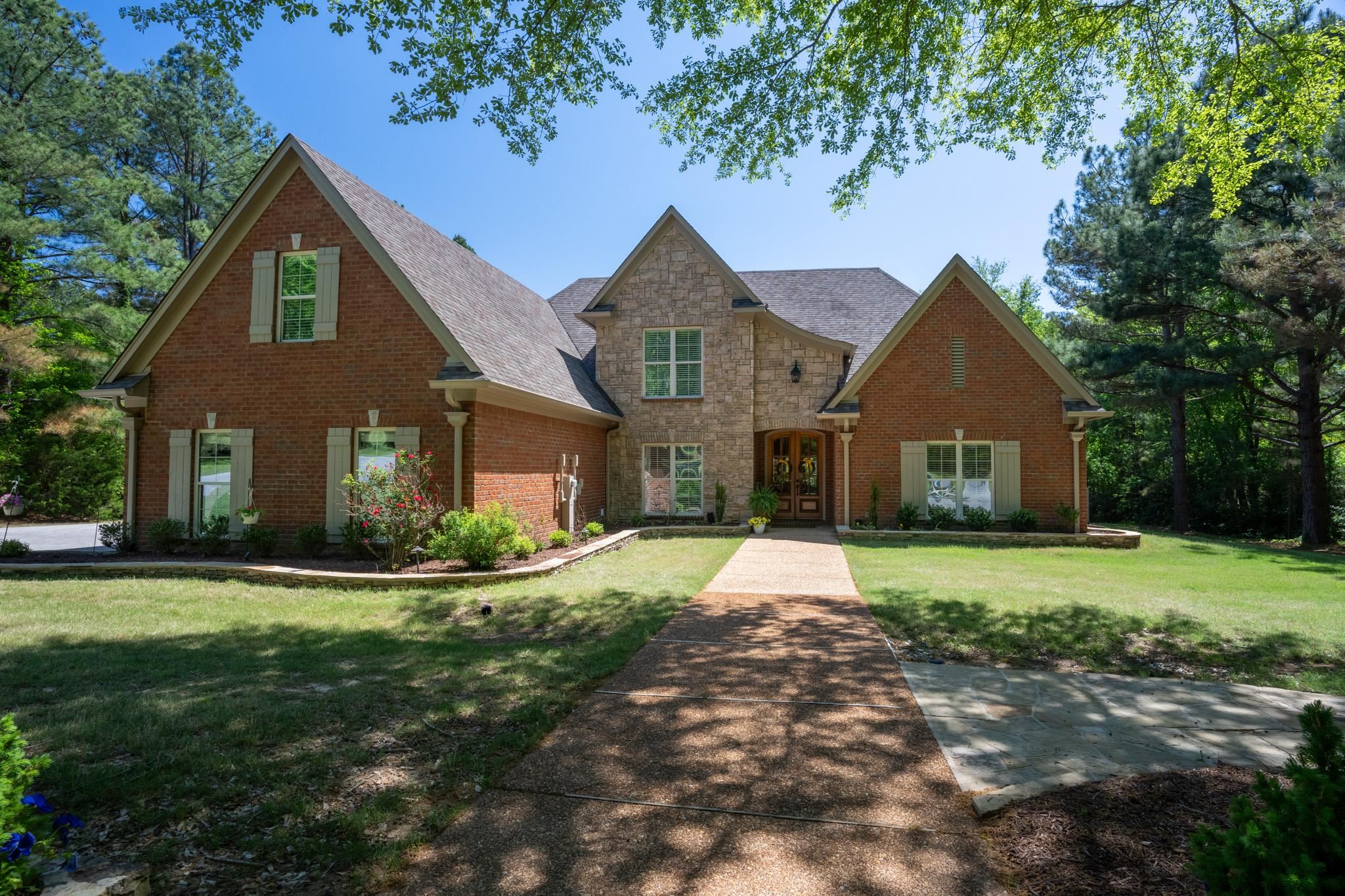 This beautiful custom built all brick home sits on 4 acres in Collierville Reserve with No City Taxes. The sellers have meticulously maintained and planned every bit of it!