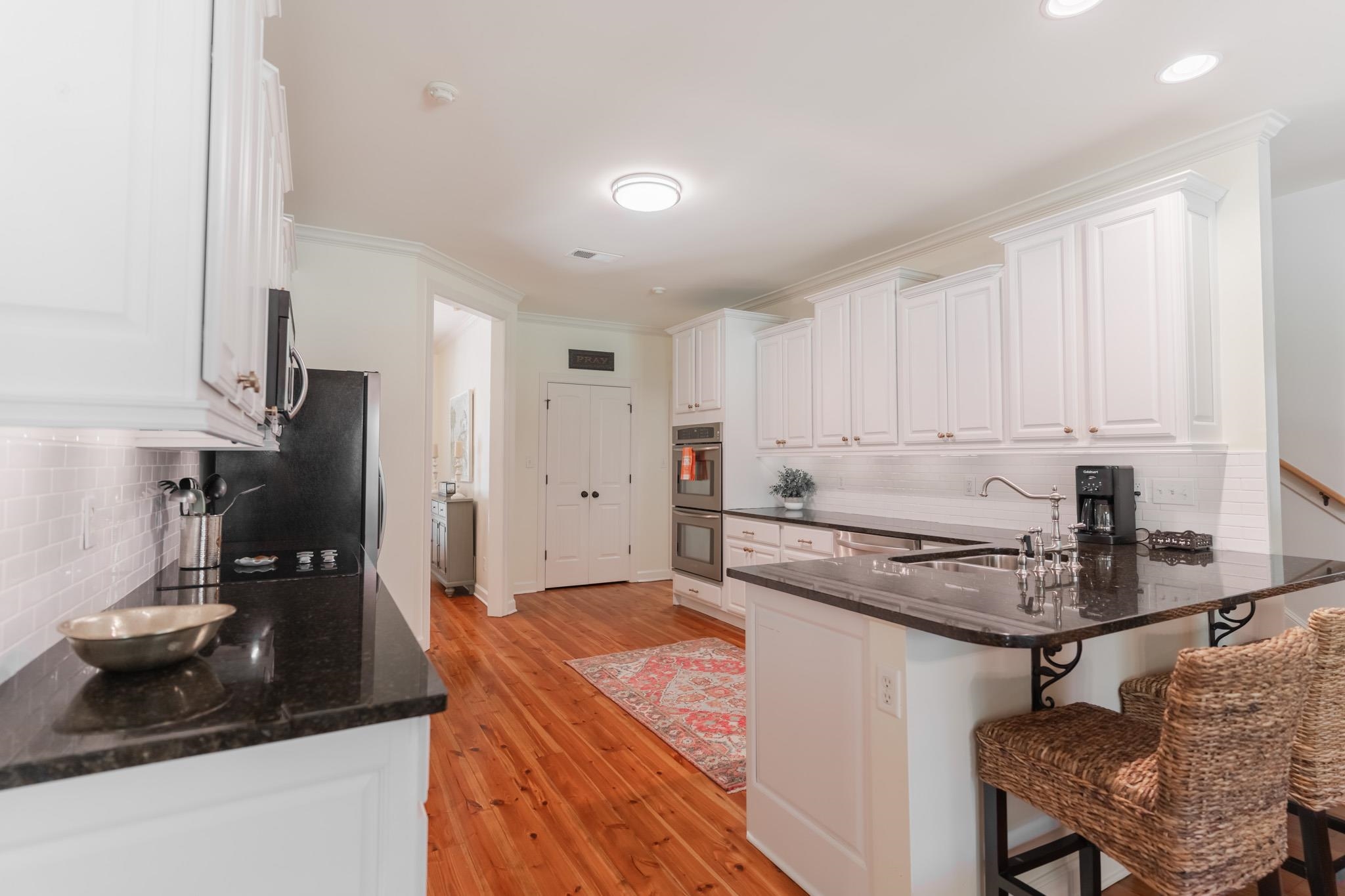 12035 Raleigh Lagrange Road East Eads, TN 38028 - Photo 11 of 37 The kitchen has TONS of cabinet space and storage! You will enjoy cooking and gathering here! Black granite is timeless for the countertops. Double doors to large pantry. Frigidaire Appliances including double ovens and built in microwave!