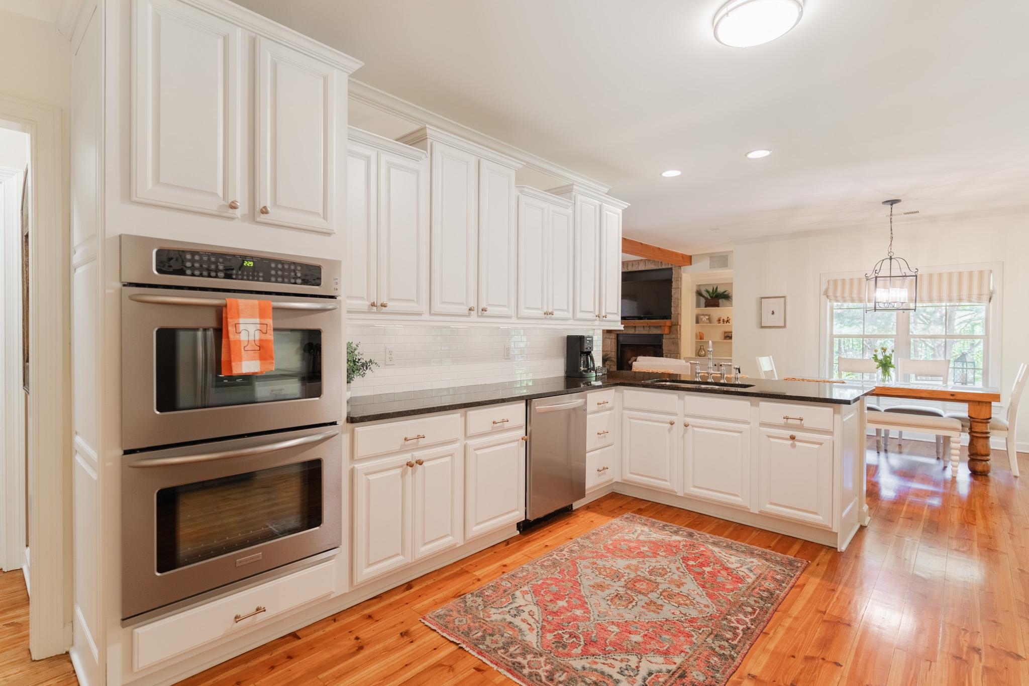 12035 Raleigh Lagrange Road East Eads, TN 38028 - Photo 12 of 37 The kitchen was updated in 2019 with fresh white cabinets and hardware and a classic subway tile backsplash. The gorgeous heart pine floors make this beautiful space. Dishwasher new in 2022.