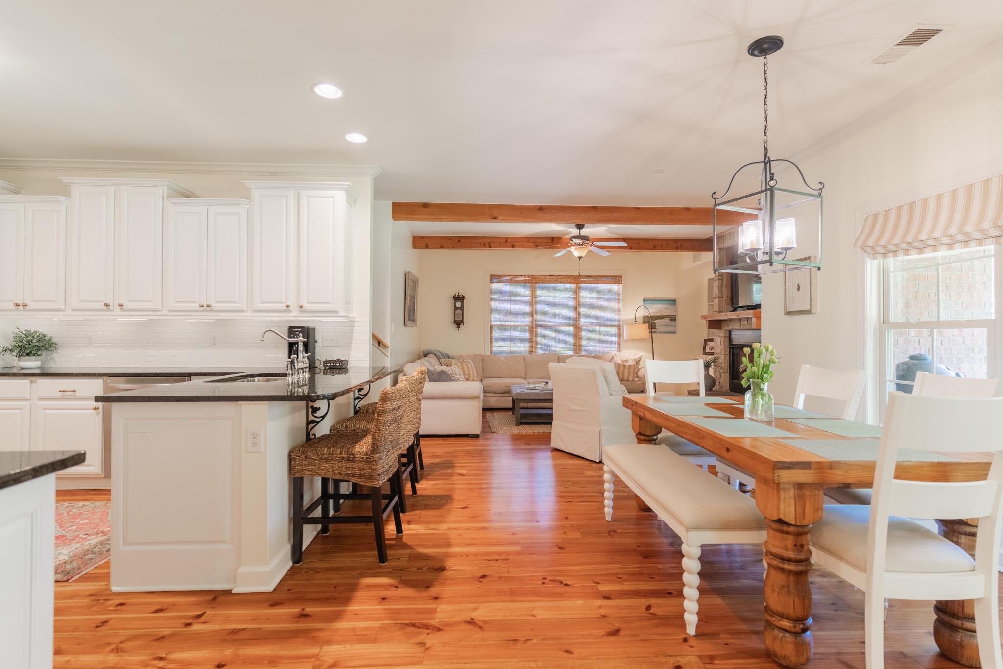 12035 Raleigh Lagrange Road East Eads, TN 38028 - Photo 13 of 37 Breakfast bar perfect for kitchen barstools. Opens into the cozy hearth room! All of the Heart Pine floors were refinished in 2021 throughout the home.
