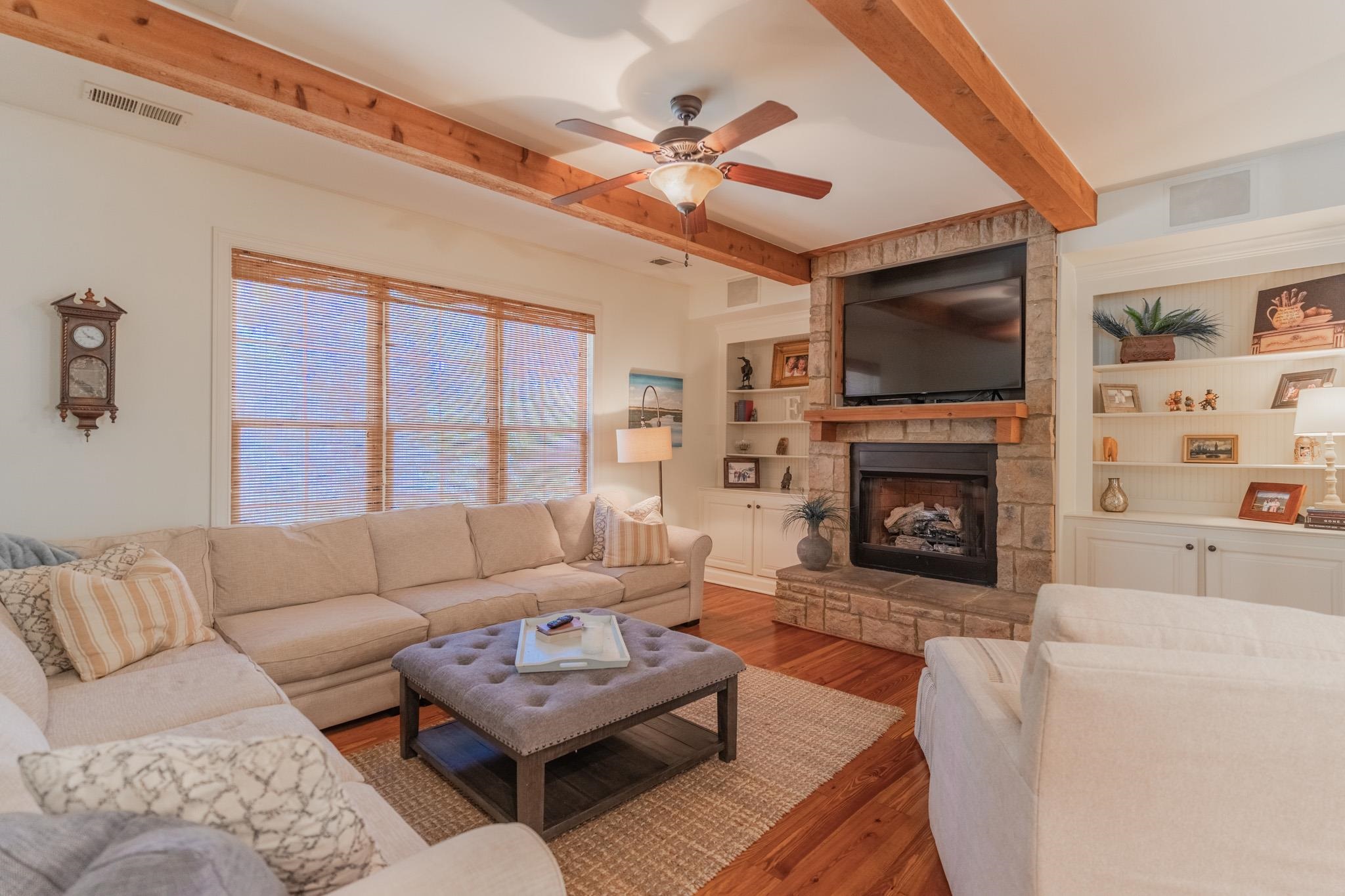 12035 Raleigh Lagrange Road East Eads, TN 38028 - Photo 15 of 37 You will never want to leave this room! It has a stone surround gas fireplace with an inset for your TV. Custom Built Ins, Cedar beams, Built In Speaker System, Ceiling Fan.