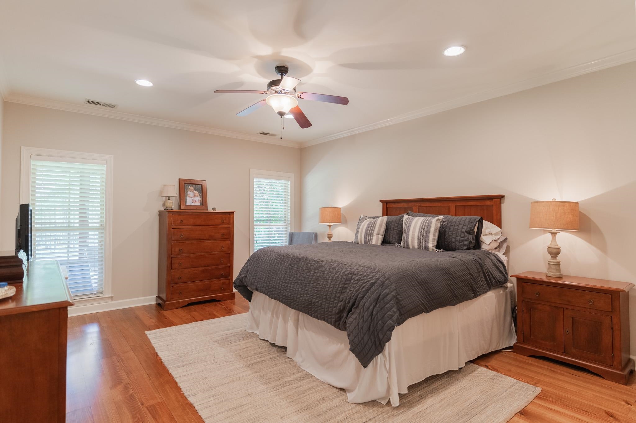 12035 Raleigh Lagrange Road East Eads, TN 38028 - Photo 16 of 37 Custom Window Treatments, ceiling fan, recessed lighting, heart pine flooring, 9 foot ceiling. The primary suite is on its own HVAC unit!