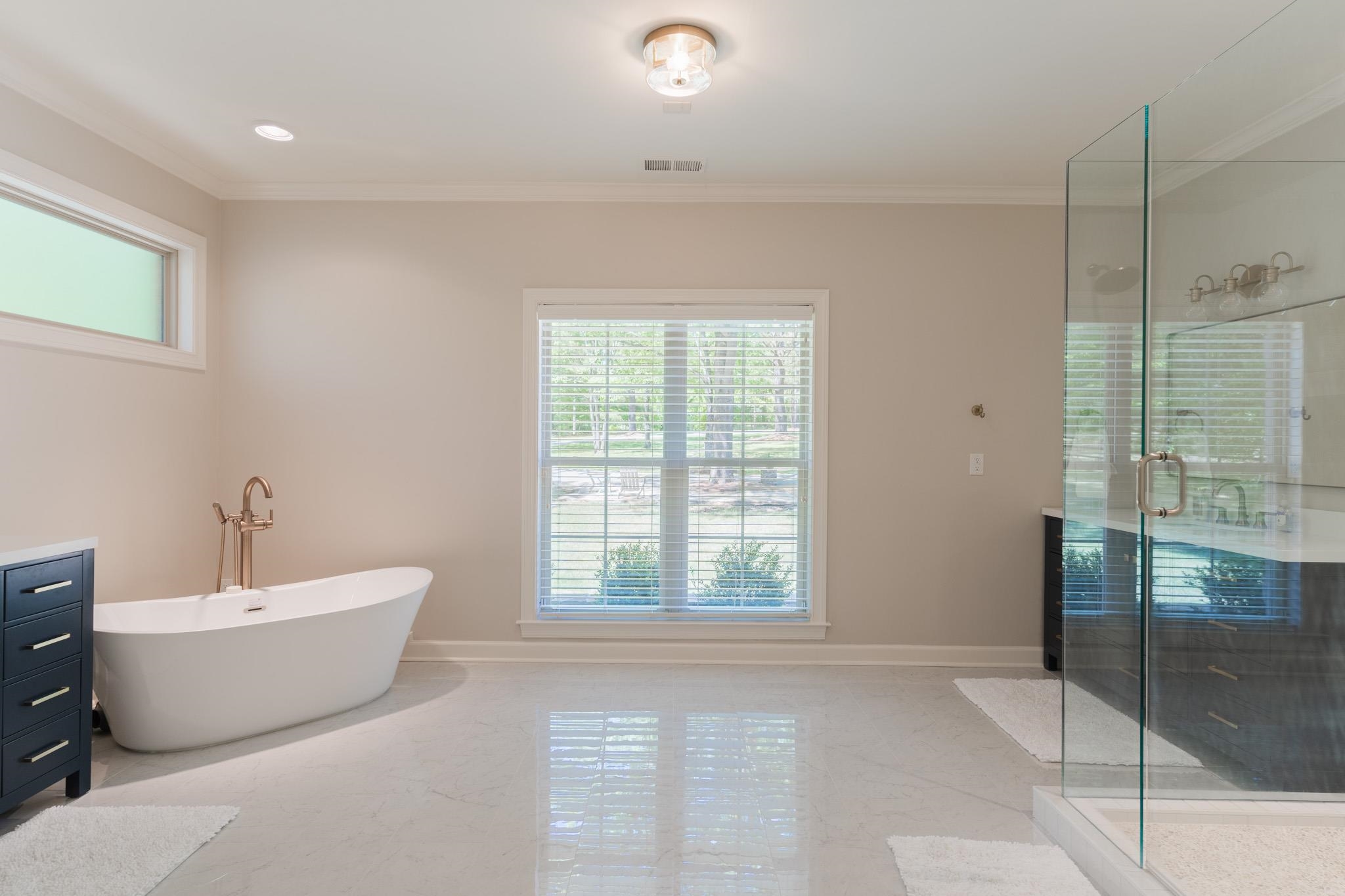 12035 Raleigh Lagrange Road East Eads, TN 38028 - Photo 17 of 37 Completely Renovated in the fall of 2023. New Tile, Walk in Shower, Freestanding Tub, His & Her Vanities, Toilet Room, 2 Huge Walk In Closets