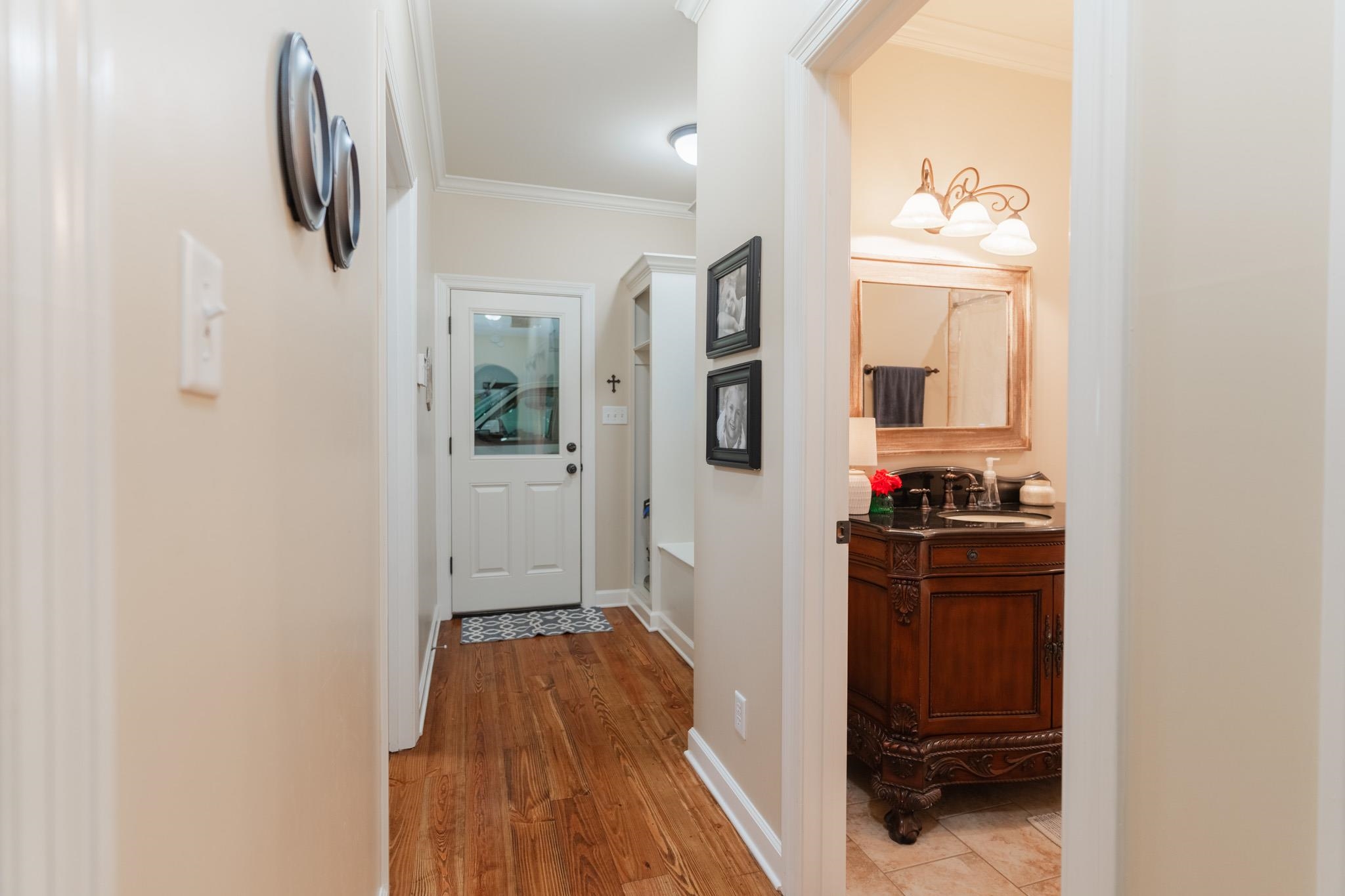 12035 Raleigh Lagrange Road East Eads, TN 38028 - Photo 21 of 37 This hallway is off the garage and has the perfect cubby to catch all! The laundry, a full bath, & 2nd downstairs bedroom is all off this hall.