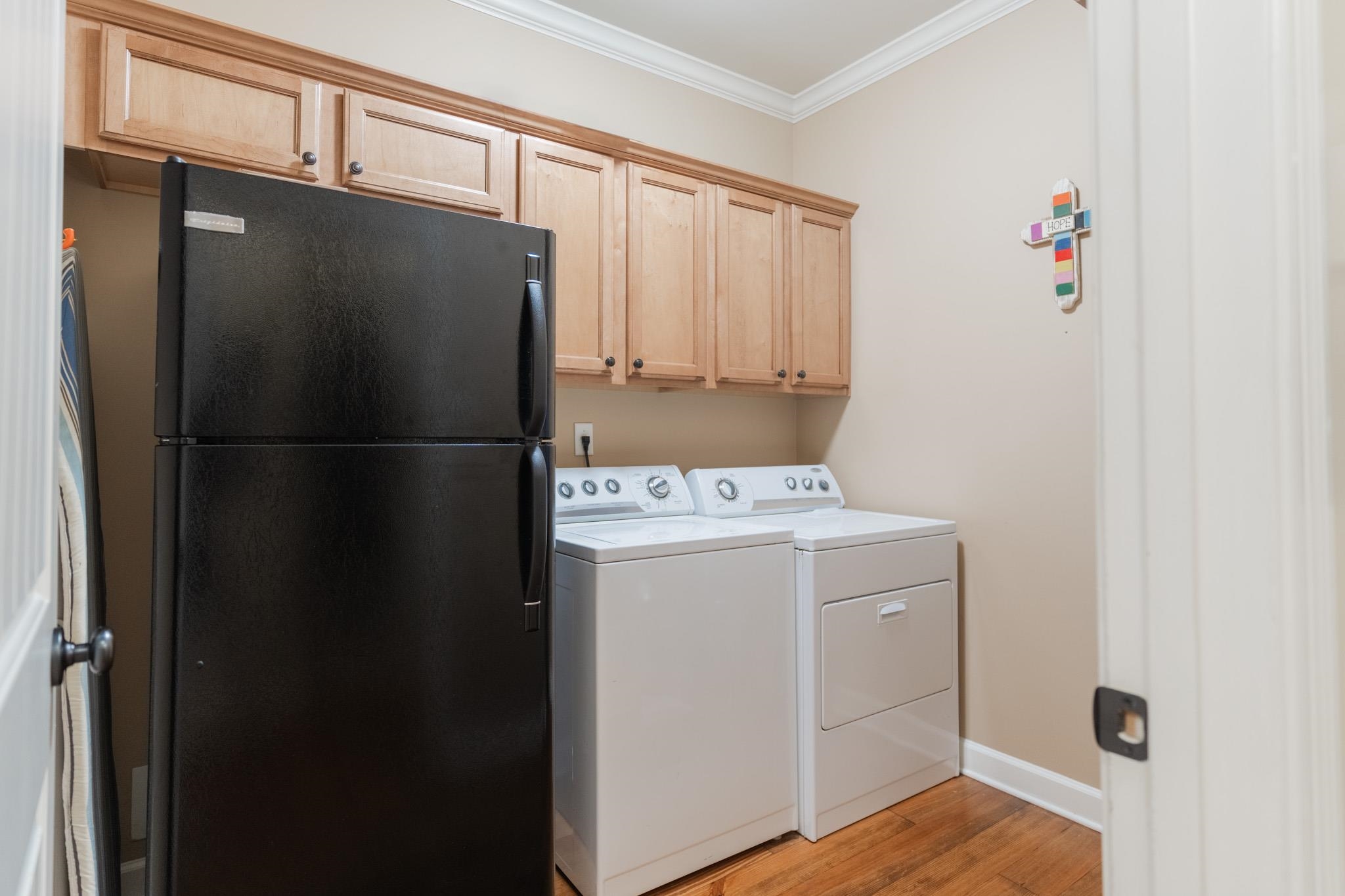 12035 Raleigh Lagrange Road East Eads, TN 38028 - Photo 23 of 37 This laundry room is in the perfect location! Built in Cabinetry & space for an extra fridge!