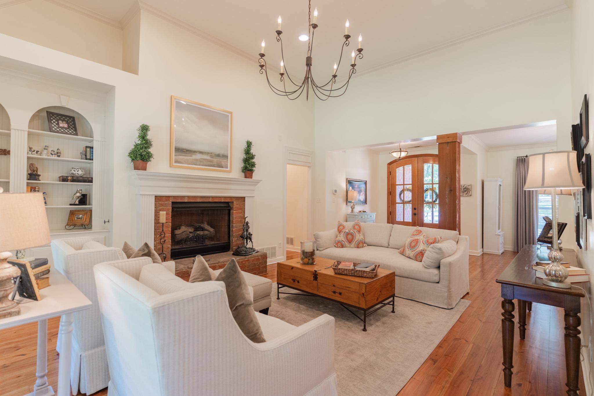 This room boasts 12 foot ceilings and gorgeous Heart Pine Floors that run through the entire downstairs!