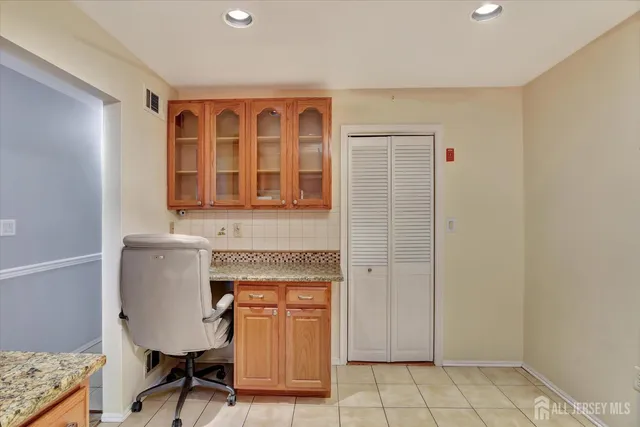 a workspace with furniture and window