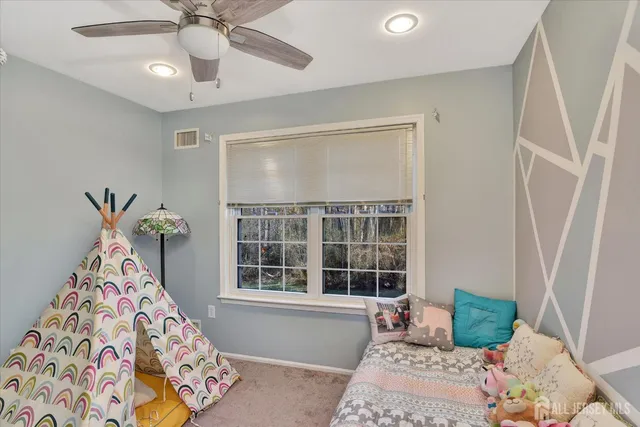 a bedroom with furniture and windows