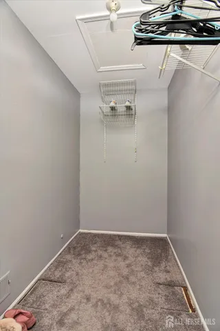 a view of a room with rack on the wall