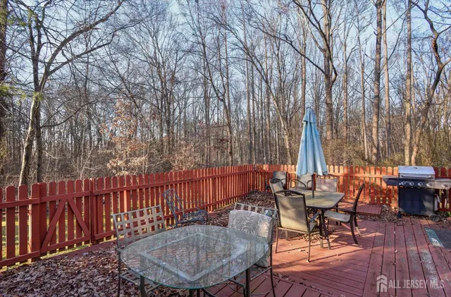 a view of a patio with a table chairs and a table