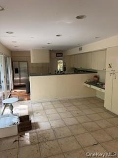 1117 Cedar Ridge Road Oyster Bay, NY 11771 - Photo 7 of 41 a view of kitchen with refrigerator and cabinets