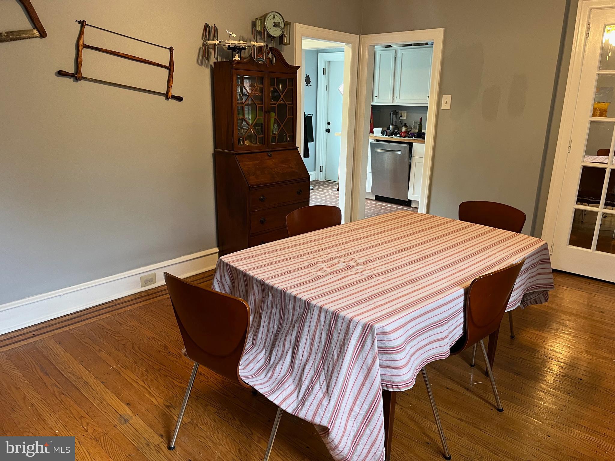 6146 Wayne Avenue, Unit 3 Philadelphia, PA 19144 - Photo 15 of 25 a kitchen with a wooden floor and refrigerator