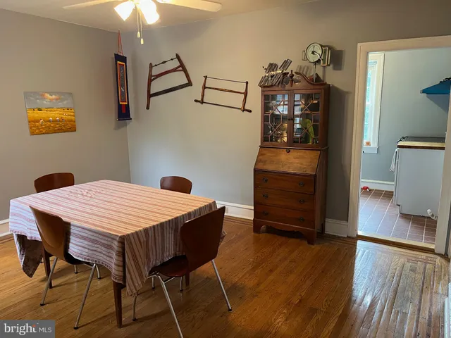 a dining room with a table and chairs