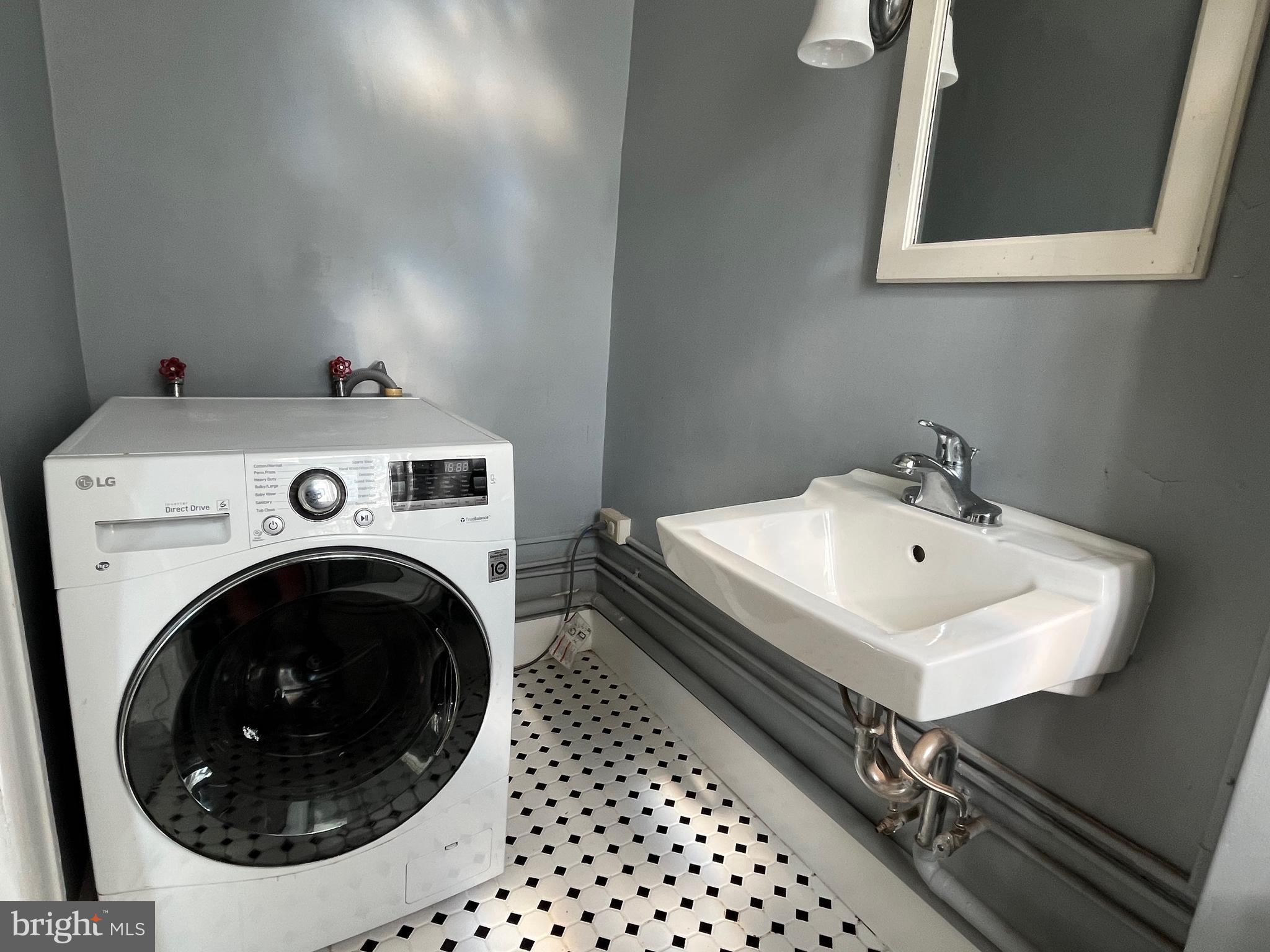 6146 Wayne Avenue, Unit 3 Philadelphia, PA 19144 - Photo 24 of 25 a utility room with dryer and washer