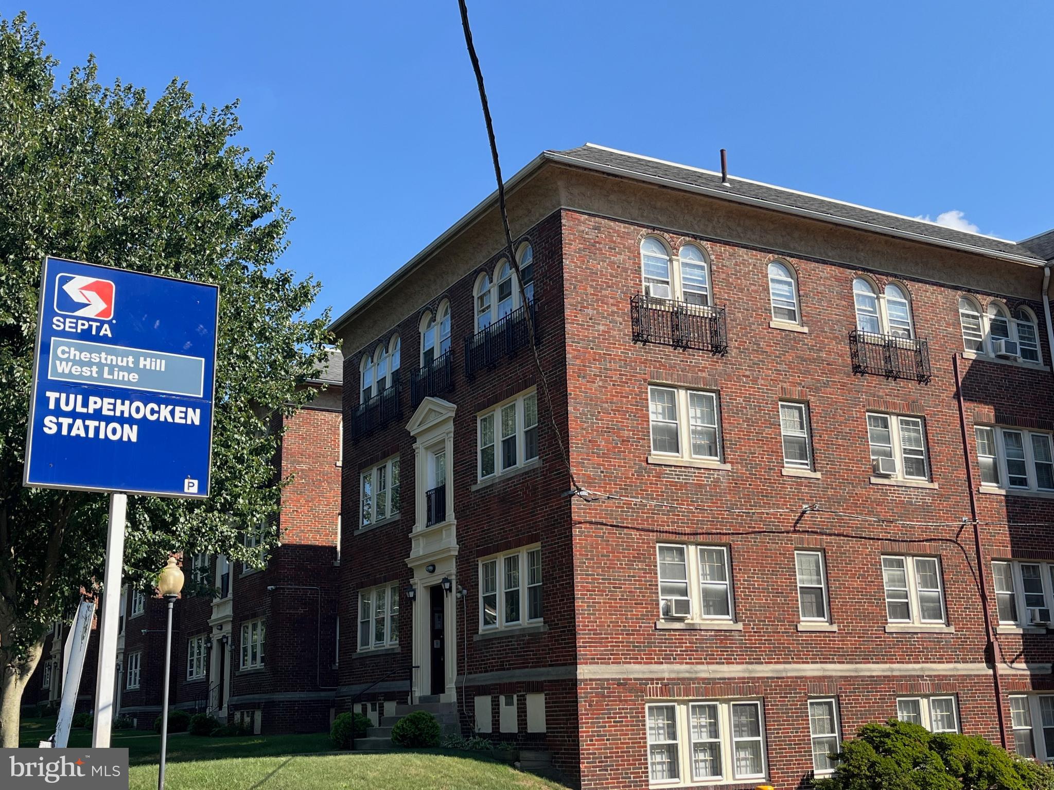 6146 Wayne Avenue, Unit 3 Philadelphia, PA 19144 - Photo 3 of 25 a street sign on a pole on a street