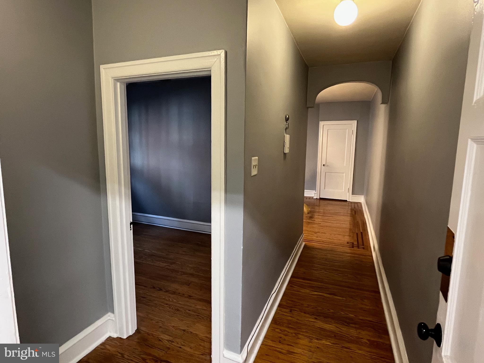 6146 Wayne Avenue, Unit 3 Philadelphia, PA 19144 - Photo 6 of 25 a view of a hallway with wooden floor