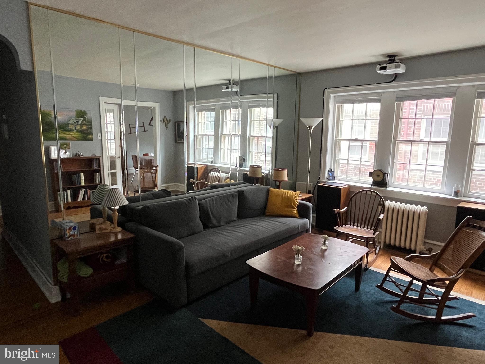 6146 Wayne Avenue, Unit 3 Philadelphia, PA 19144 - Photo 8 of 25 a living room with furniture and a window