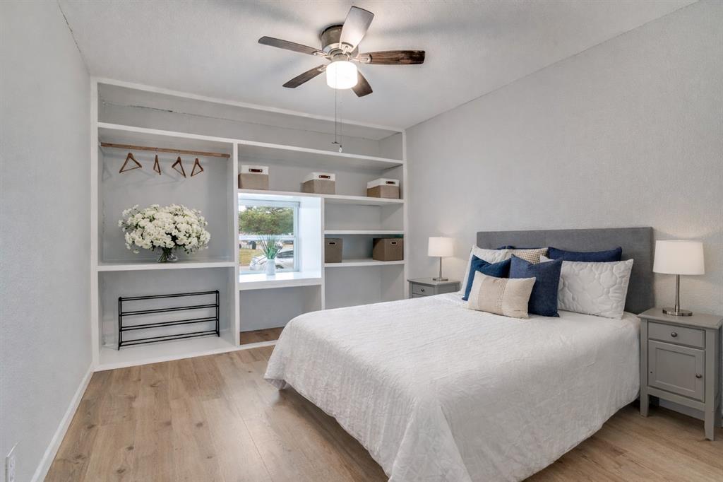 406 Freeman Street Mesquite, TX 75149 - Photo 12 of 22 a bedroom with a bed and a painting on the wall