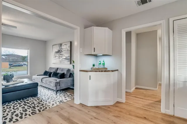 a living room with furniture and a rug