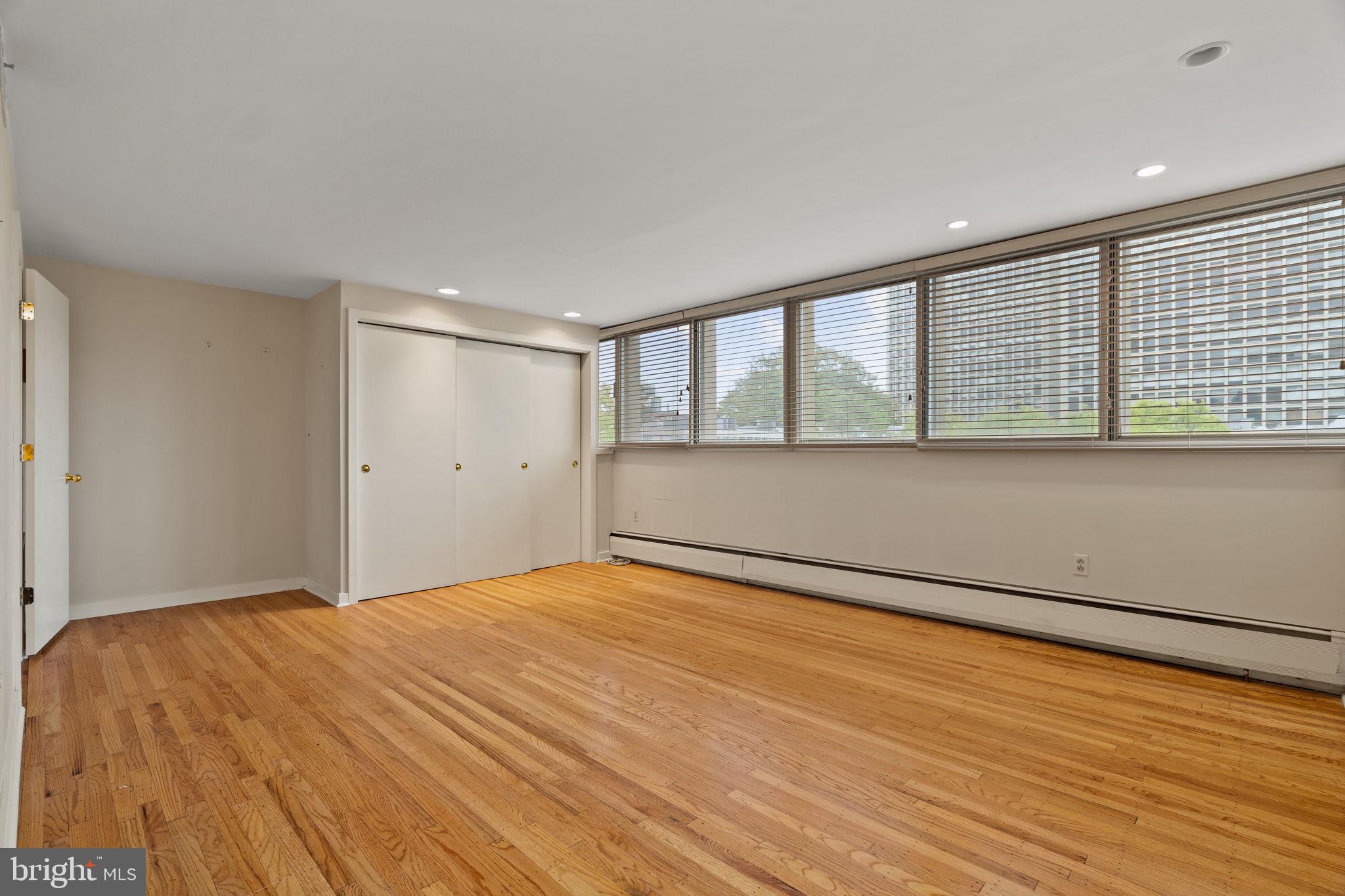245 South 3rd Street Philadelphia, PA 19106 - Photo 41 of 63 a view of an empty room with wooden floor and a window