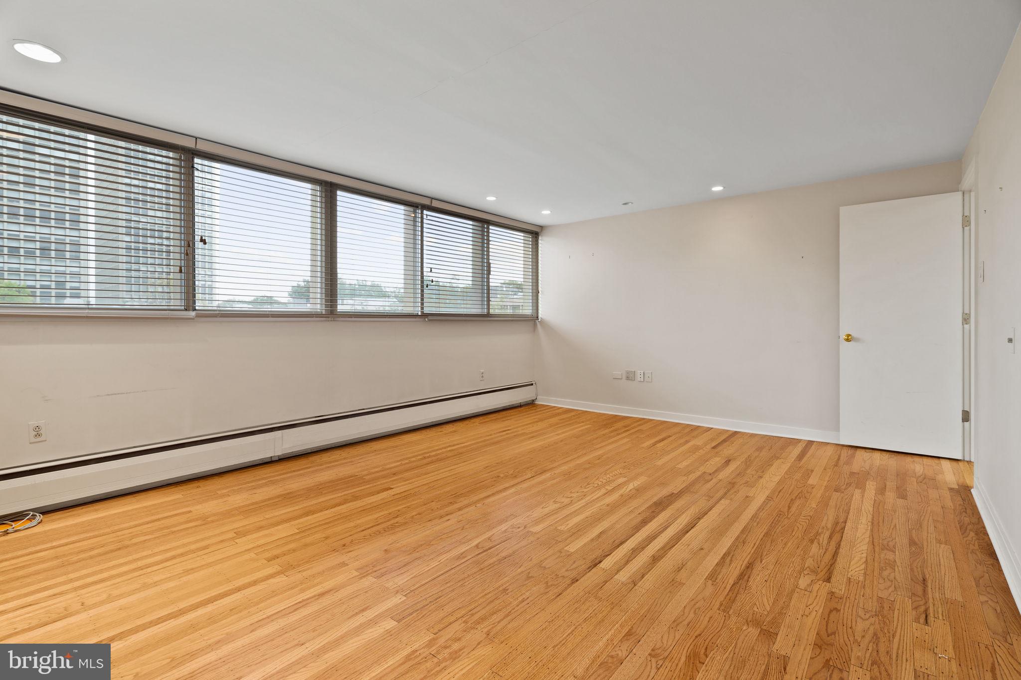 245 South 3rd Street Philadelphia, PA 19106 - Photo 43 of 63 a view of empty room with wooden floor and fan