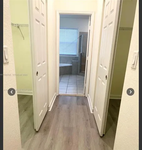 a view of a bathroom from a hallway