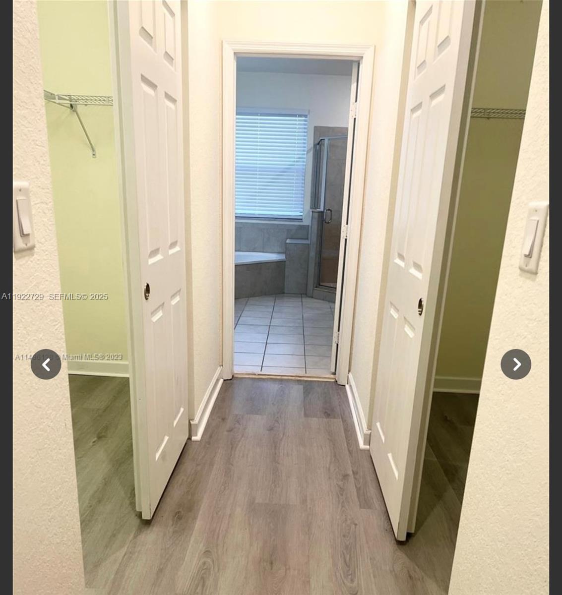 10091 West 35th Lane, Unit 10091 Hialeah, FL 33018 - Photo 17 of 32 a view of a bathroom from a hallway