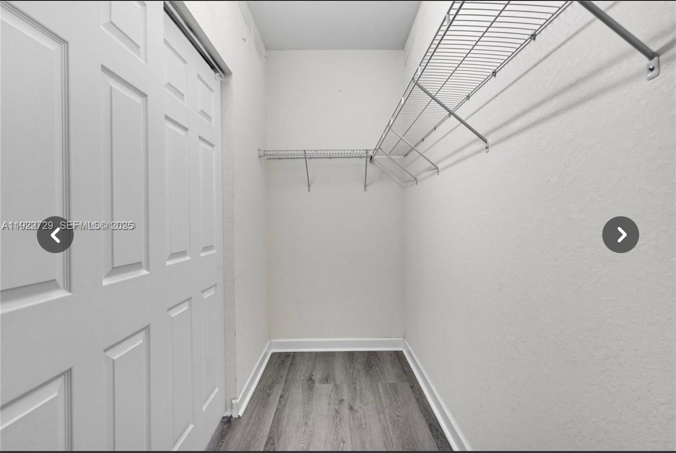 10091 West 35th Lane, Unit 10091 Hialeah, FL 33018 - Photo 18 of 32 a view of a room with racks on the wall