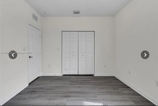 a view of room with hardwood floor