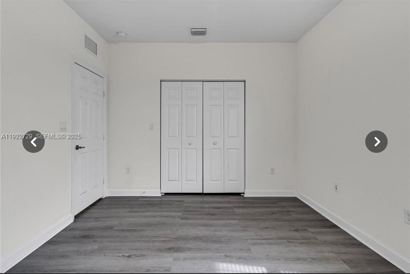 10091 West 35th Lane, Unit 10091 Hialeah, FL 33018 - Photo 20 of 32 a view of room with hardwood floor
