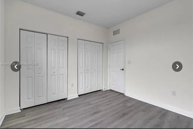 a view of a livingroom with wooden floor