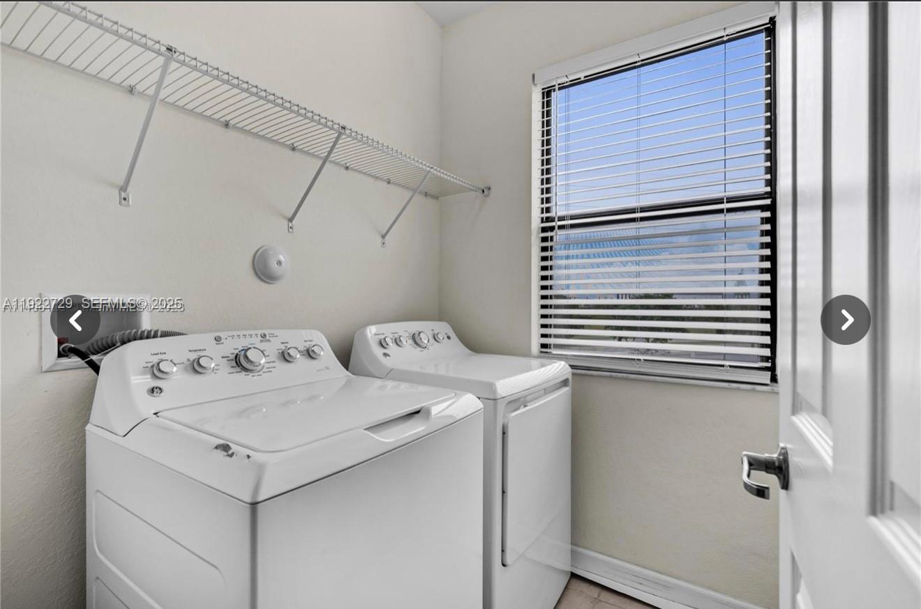 10091 West 35th Lane, Unit 10091 Hialeah, FL 33018 - Photo 27 of 32 a utility room with dryer and washer