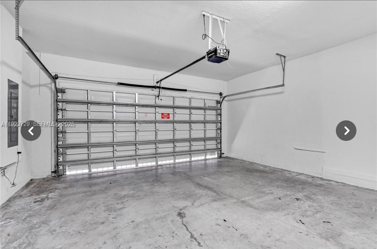 10091 West 35th Lane, Unit 10091 Hialeah, FL 33018 - Photo 29 of 32 a view of a garage