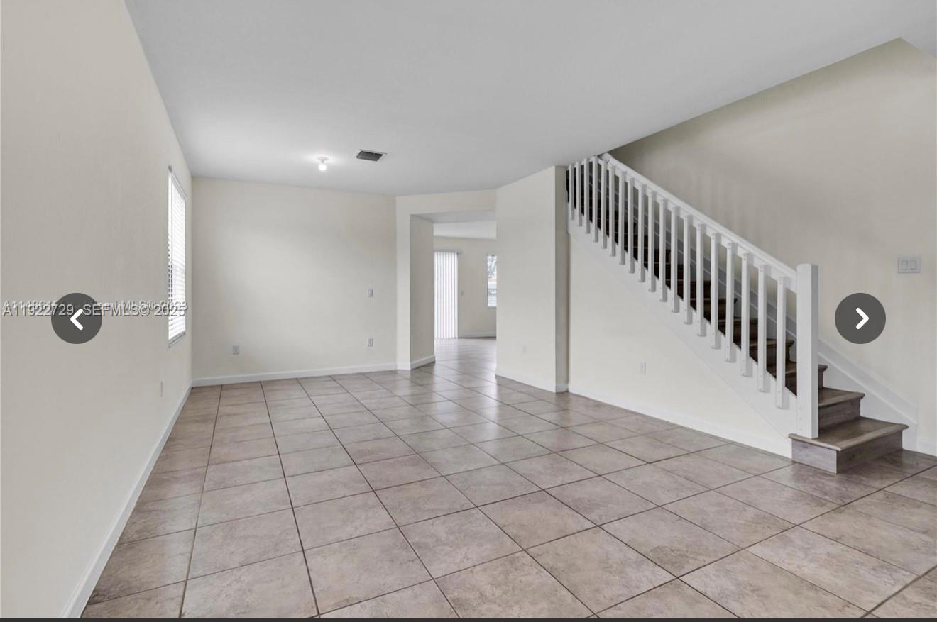 10091 West 35th Lane, Unit 10091 Hialeah, FL 33018 - Photo 5 of 32 a view of an entryway with stairs