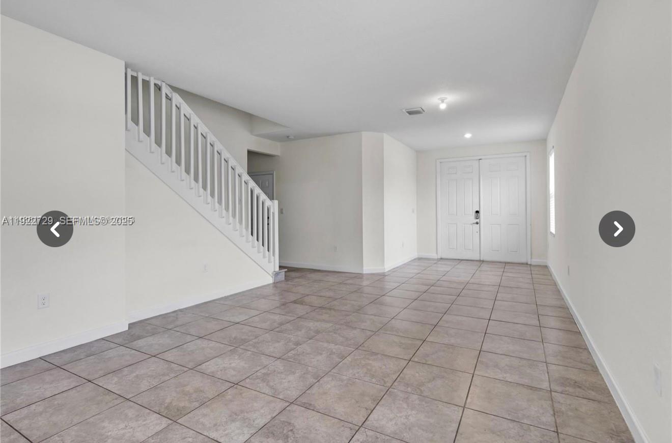10091 West 35th Lane, Unit 10091 Hialeah, FL 33018 - Photo 7 of 32 a view of an entryway with a hall