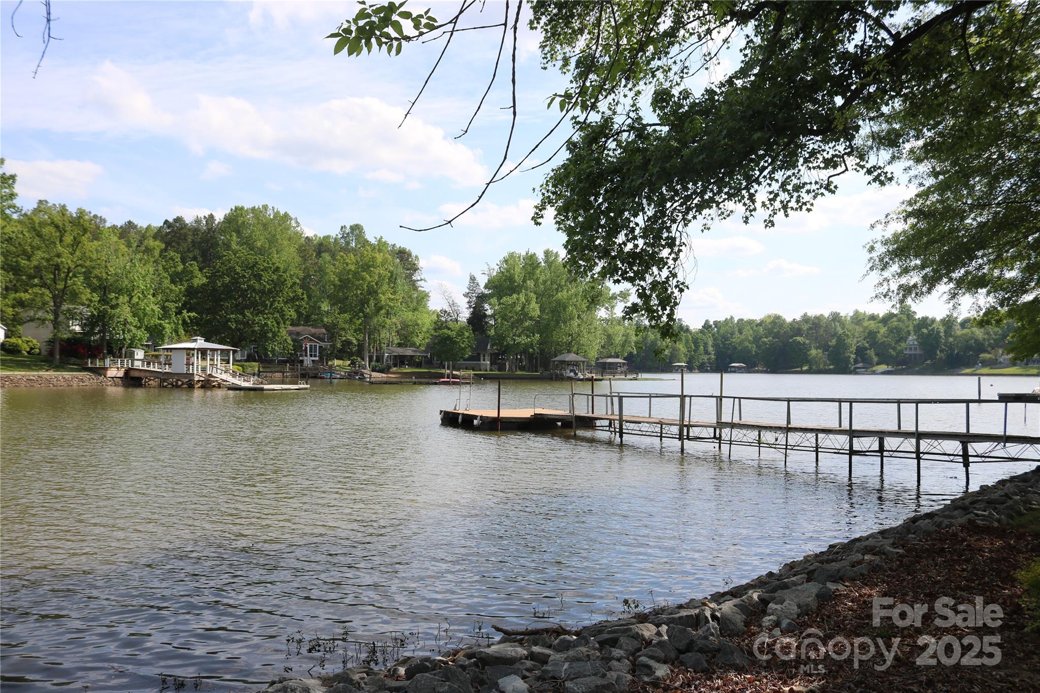 5165 Sapp Circle Clover, SC 29710 - Photo 1 of 11 a view of a lake with boats and trees in the background