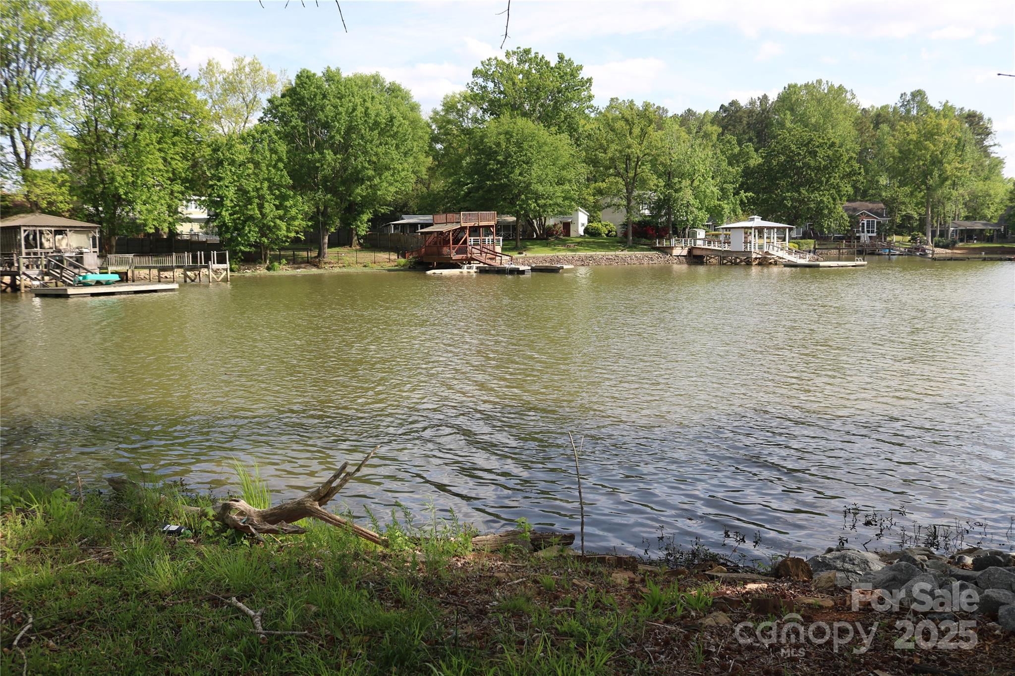 5165 Sapp Circle Clover, SC 29710 - Photo 4 of 11 a view of a water with boats and trees in the background