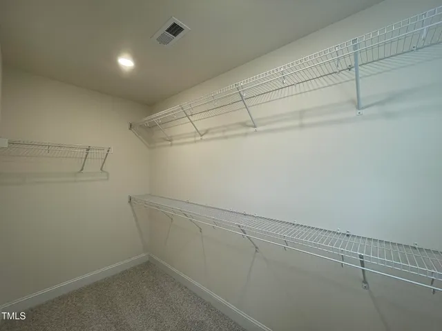 a view of a house with potted plants