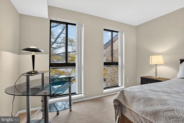 a bedroom with furniture and a window