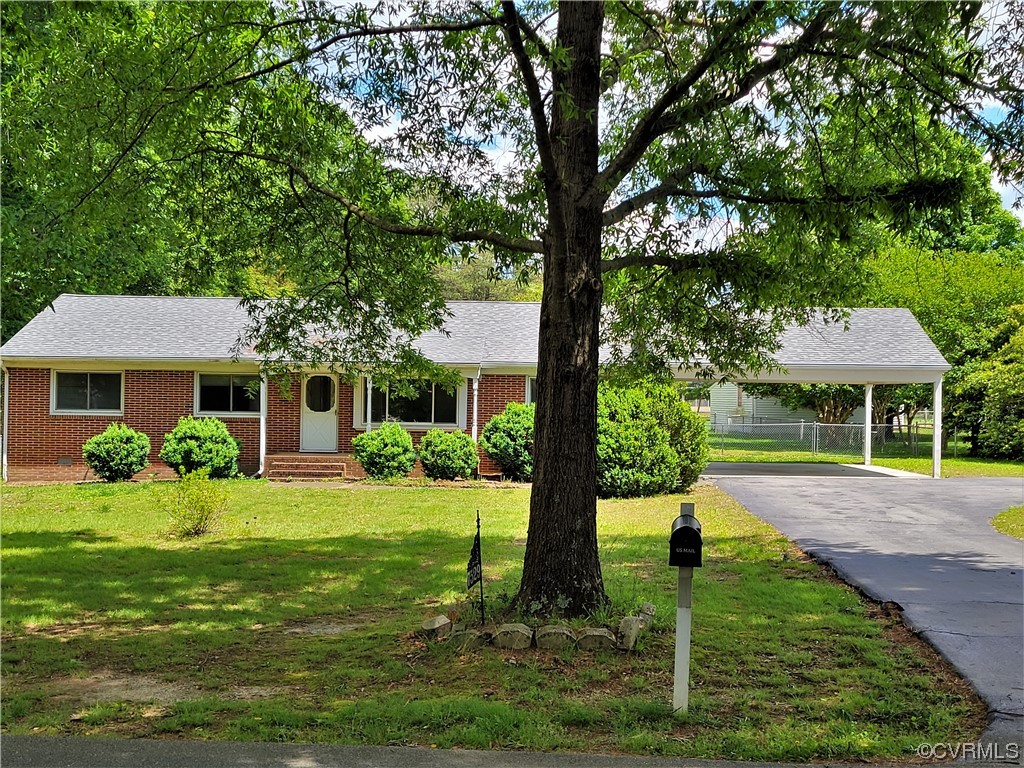 7529 Wilton Road Henrico, VA 23231 - Photo 1 of 31 a front view of a house with a yard
