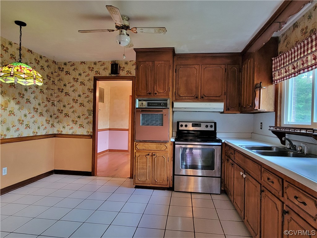 7529 Wilton Road Henrico, VA 23231 - Photo 11 of 31 a kitchen with stainless steel appliances granite countertop a stove a sink and a refrigerator