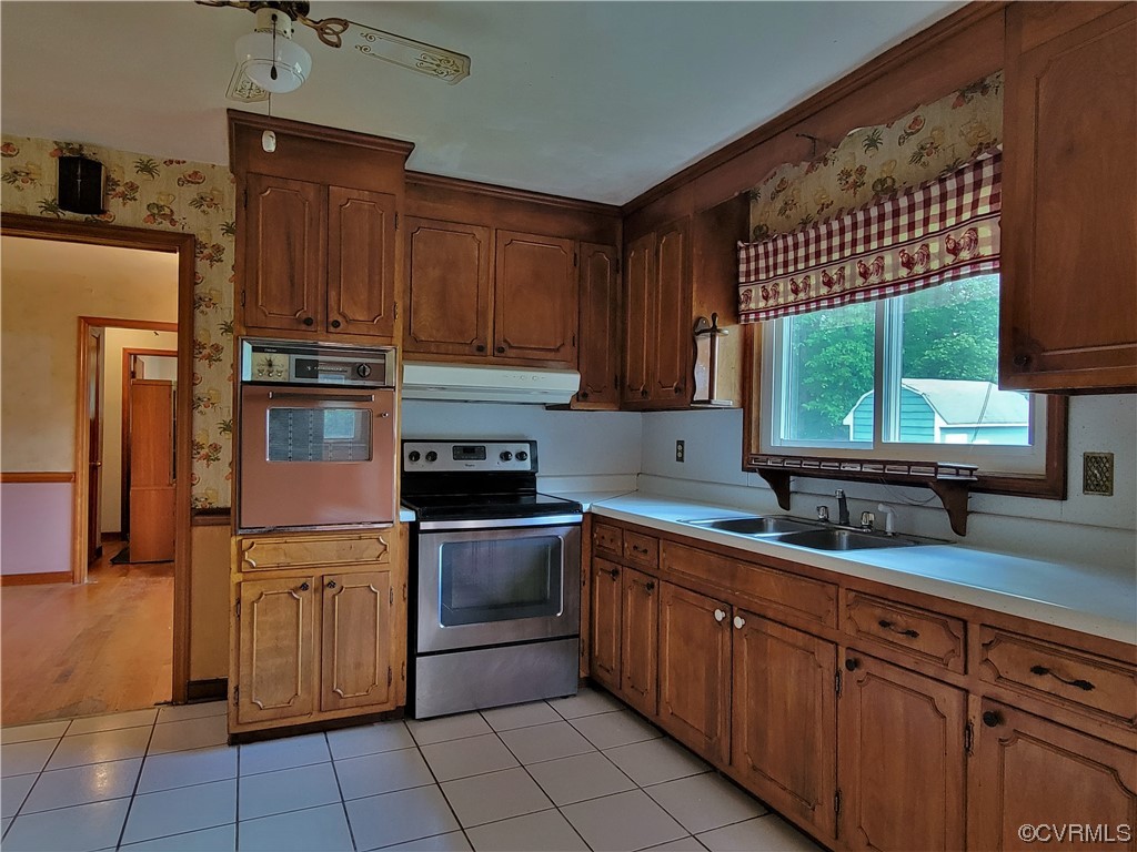 7529 Wilton Road Henrico, VA 23231 - Photo 12 of 31 a kitchen with stainless steel appliances granite countertop a sink stove and cabinets